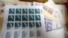 Image #4 of auction lot #1099: Four swollen cartons of United States postage consisting of year sets,...