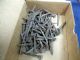 Image #1 of auction lot #1050: OFFICE PICKUP ONLY Small lot of railroad tie date nails. Looks to be a...